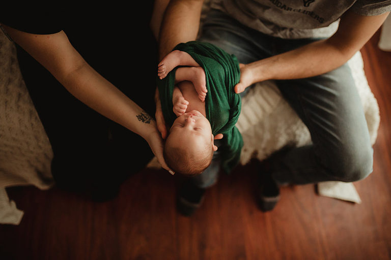 newborn in parents hands