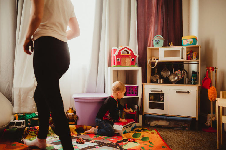 Mother cleans up after child